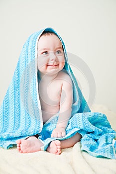 Baby Boy After Bath Wrapped in Blue Towel Sitting