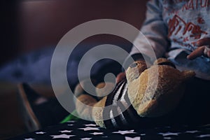 Baby playing with a teddy bear. photo