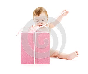 Baby boy with big gift box