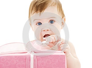 Baby boy with big gift box