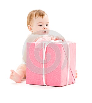 Baby boy with big gift box