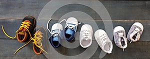 Baby boy blue shoes variety on blue color background, top view