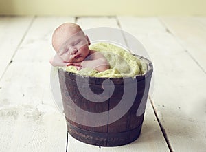 Baby boy in a bucket