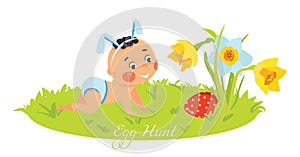 Baby boy in bunny ears hunting for eggs