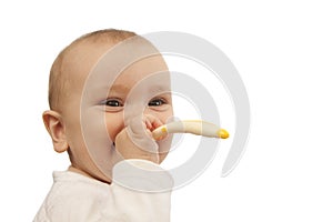 Baby boy child eating with spoon isolated