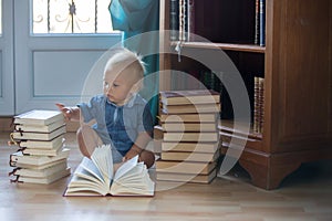 Baby boy, child, playing with books at home