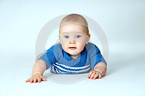 Baby boy close-up on a gray background