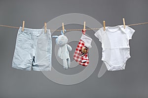 Baby boy clothes with santa bags on the clothesline