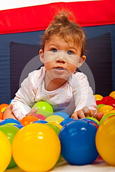 Baby boy with colorful balls