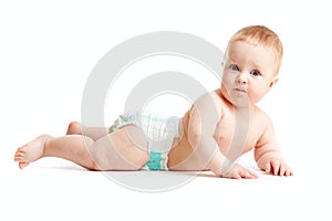 Baby boy in diaper lying isolated