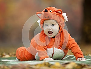 Baby boy dressed in fox costume