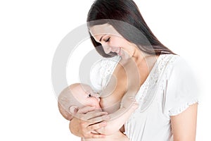 Baby boy drinking breastmilk on isolated white background