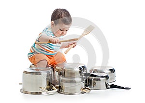 Baby boy drumming playing with pots