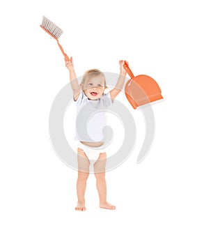 Baby boy with with dustpan and brush