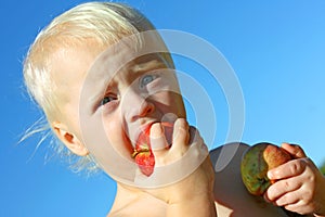 Baby Boy Eating Apple Outside