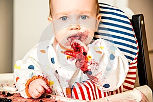 Baby boy eating berries