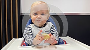 Baby boy eating lemon