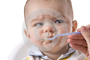 Baby Boy Is Fed With A Spoon photo