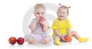 Baby boy and girl eating healthy food isolated