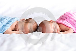 Baby boy and girl twins in bed photo