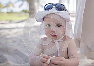 Baby Boy with Good Sun Protection on the Beach in Mexico