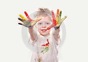 The baby boy with gouache soiled hands and shirt isolated