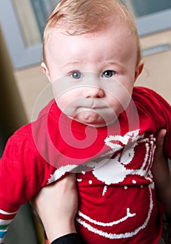 Baby boy held by mother photo