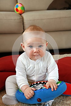 Baby boy with his first toys