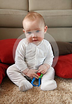 Baby boy with his first toys