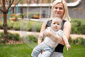 baby boy with his mum in the park