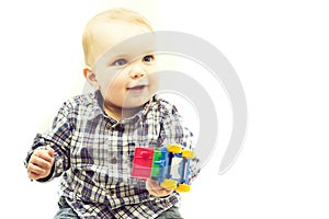 Baby boy holding toy car