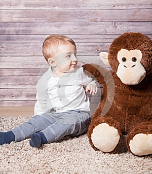 Baby boy with huge monkey toy