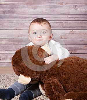 Baby boy with huge monkey toy