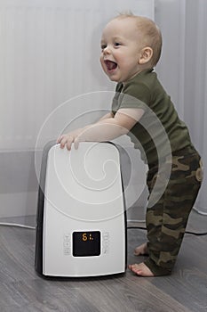 Baby boy and humidifier