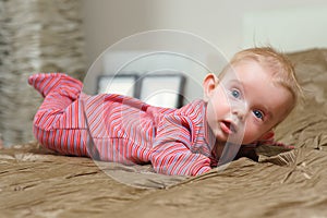 Baby boy lying on belly