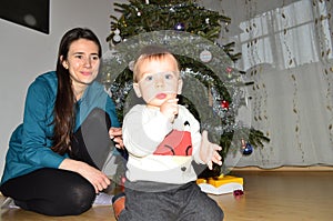 Baby boy and mother on Christmas day