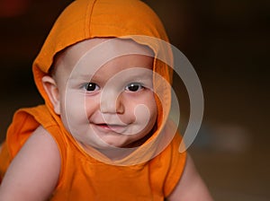 Baby boy in orange hoodie