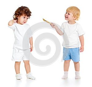 Baby boy with paint brush and girl standing full length isolated