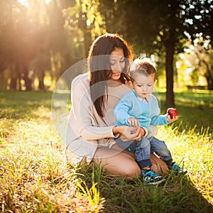 Baby boy in the park with his mum