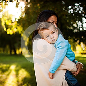 Baby boy in the park with his mum