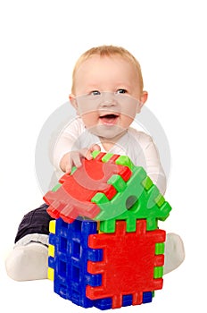 Baby boy playing with building puzzle