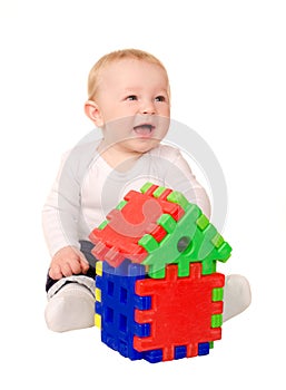 Baby boy playing with building puzzle