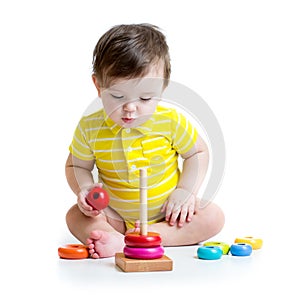 Baby boy playing with colorful toy