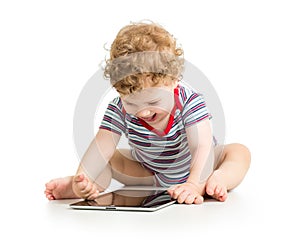 Baby boy playing with digital tablet