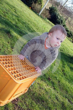 Baby boy playing in garden