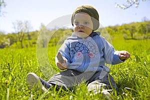 Baby boy playing on grass