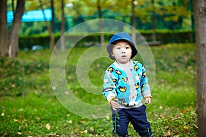 Baby boy playing on grass