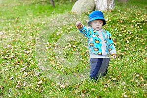 Baby boy playing on grass