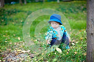 Baby boy playing on grass