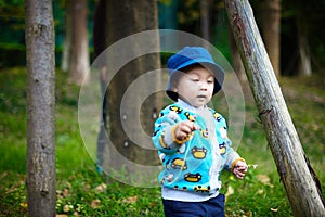 Baby boy playing on grass